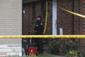 A Toronto Police officer protects the crime scene on Shenley Rd. where a wanted 35-year-old Scarborough man fired close to 20 bullets at undercover officers at a Shenley Rd. home north of Eglinton Ave. E. and Kennedy Rd. around 8:30 pm Tuesday night. The officer looks at 11 shots that struck a neighboring home. The man was taken into custody after a two and a half hour standoff.