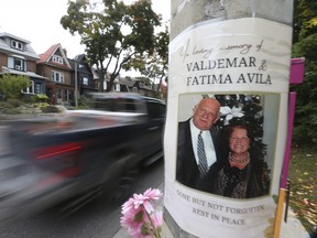 Signage, flowers, speed cams are all visible on Parkside Dr. on Thursday, Oct. 20, 2022, one year after Valdemar and Fatima Avila were killed in a horrific crash, yet motorists continue to ignore the posted 40 km/h speed limit.