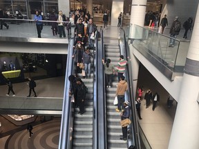 People seen shopping at the Eaton Centre in downtown Toronto, Oct. 21, 2022.