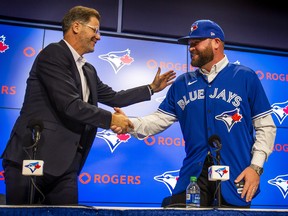Toronto Blue Jays general manager Ross Atkins (left) announces the removal interim tag from manager John Schneider - making the manager title permanent - during a press conference at the Rogers Centre in Toronto, Ont. on Friday October 21, 2022. Ernest Doroszuk/Toronto Sun/Postmedia