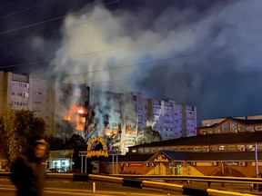 A view shows a site of a plane crash on residential building in the southern city of Yeysk, Russia Oct. 17, 2022.