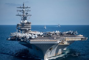 South Korean and U.S. Naval Vessels including aircraft carrier USS Ronald Reagan take part in a joint navy exercise off South Korea coast, in this handout photo provided by South Korean Navy and relased by Yonhap on Sept. 29, 2022.