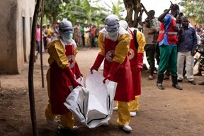 Ebola infects 6 school children in Uganda as fear of contagion grows 4 Red Cross workers carry a body bag containing a 3-year-old boy suspected of having died of Ebola in Mubende, Uganda on October 13, 2022.