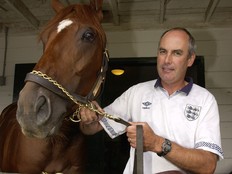 Canadian Triple Crown favourite Wando and trainer Mike Keough, take a break after training in preparation for Saturday's running of the Breeders' Stakes at Woodbine.