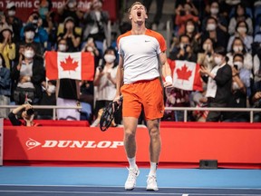 Denis Shapovalov of Canada celebrates his victory against Steve Johnson of the US during their men's singles match at the Japan Open tennis tournament in Tokyo on October 5, 2022.