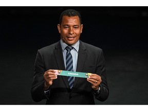 Former Brazil player Gilberto Silva displays the country Canada during the football draw ceremony for the Australia and New Zealand 2023 FIFA Women's World Cup at the Aotea Centre in Auckland on October 22, 2022. (Photo by WILLIAM WEST / AFP)