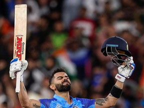 India's Virat Kohli celebrates after their win during the ICC men's Twenty20 World Cup 2022 cricket match between India and Pakistan at Melbourne Cricket Ground (MCG) in Melbourne on October 23, 2022.