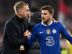 Chelsea's English head coach Graham Potter (L) reacts with Chelsea's English midfielder Mason Mount at the end of the UEFA Champions League Group E football match between RB Salzburg and Chelsea FC in Salzburg, Austria on October 25, 2022.