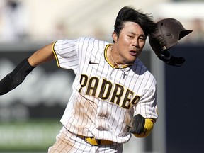 San Diego Padres' Ha-Seong Kim scores on a hit by Austin Nola during the fifth inning of Game 2 of the NL Championship Series on Wednesday, Oct. 19, 2022, in San Diego.