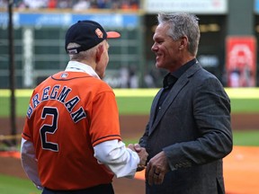 Oct 20, 2022; Houston, Texas, USA; Jim McIngvale, aka Mattress Mack, shakes hands with former Houston Astros second baseman Craig Biggio (right) before game two of the ALCS against the New York Yankees for the 2022 MLB Playoffs at Minute Maid Park.