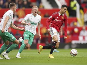 Manchester United's Cristiano Ronaldo, right, in action during the English Premier League soccer match between Manchester United and Newcastle at Old Trafford stadium in Manchester, England, Sunday, Oct. 16, 2022.