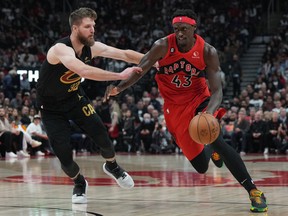 Raptors forward Pascal Siakam (43) controls the ball as Cleveland Cavaliers forward Dean Wade (32) tries to defend at Scotiabank Arena.