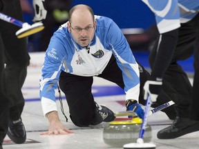 Quebec skip Jean-Michel Menard watches a rock as they play Saskatchewan in draw 6 action at the Tim Hortons Brier curling championship at Mile One Centre in St. John's on Monday, March 6, 2017.