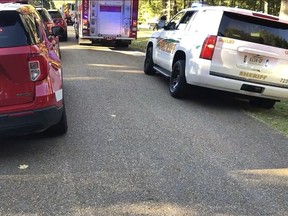 This image provided by Shelby Sheriff's Office shows emergency vehicles at the scene of a dog attack on Wednesday, Oct. 5, 2022 in Shelby, Tenn.