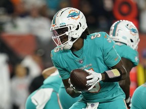 Miami Dolphins quarterback Teddy Bridgewater hands off during the first half of an NFL football game against the Cincinnati Bengals, Thursday, Sept. 29, 2022, in Cincinnati.