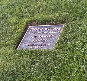 A plaque marks the sport where Tiger Woods made his famous “Shot in the Dark.” (Jon McCarthy Photo)