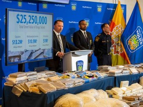 Peel officers busted five men allegedly running narcotics under the guise of a trucking firm, nabbing more than $25 million of drugs.