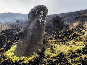 This handout picture released by the Rapanui Municipality shows Moais affected by a fire at the Rapa Nui National Park in Easter Island, Chile, on October 6, 2022.