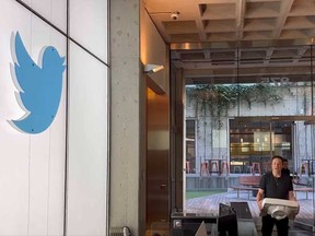 Elon Musk is pictured carrying a sink into Twitter's San Francisco headquarters in a screen grab of a video posted on his Twitter account on Wednesday.,