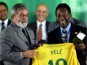 FILE: Brazilian President Luiz Inacio Lula da Silva (L) and Brazilian football legend Edson Arantes do Nacimento, known as Pele, hold a jersey during a ceremony to decorate the winners of the 1958 World Cup, in an opening ceremony of an exposition celebrating the 50th anniversary of Brazil’s first victory in this tournament, at Planalto palace in Brasilia on June 26, 2008.