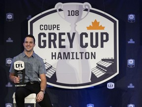 Hamilton Tiger Cats' Mike Daly is awarded the Tom Pate Award during the CFL Awards in Hamilton, Ont., on Friday, Dec. 10, 2021.