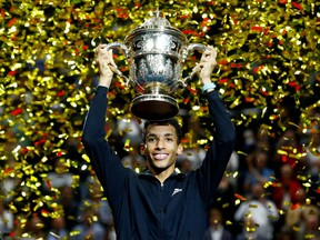 Canada's Felix Auger-Aliassime celebrates with trophy after winning his final match against Denmark's Holger Rune at the ATP 500 in St. Jakobshalle, Basel, Switzerland, Oct. 30, 2022.