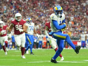 Sep 25, 2022; Glendale, Arizona, USA; Los Angeles Rams wide receiver Allen Robinson II (1) runs after making a catch against the Arizona Cardinals during the second half at State Farm Stadium.