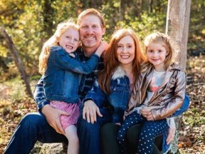 Phil Paxson, 47, is seen with his wife Alicia and their two daughters in a photo posted on GoFundMe.
