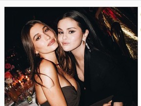 Hailey Bieber and Selena Gomez pose together at the Academy Museum Gala in Los Angeles on Saturday.