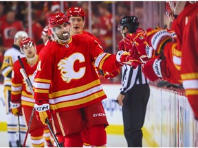 Oct 25, 2022; Calgary, Alberta, CAN; Calgary Flames center Nazem Kadri celebrates his goal with teammates against the Pittsburgh Penguins during the first period at Scotiabank Saddledome.