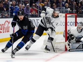 Oct 29, 2022; Los Angeles, California, USA; Toronto Maple Leafs center David Kampf (64) controls the puck in front of Los Angeles Kings left wing Kevin Fiala (22) and goaltender Cal Petersen (40) during the 3rd period at Crypto.com Arena. The Kings won 4-2.