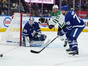 Oct 20, 2022; Toronto, Ontario, CAN; Toronto Maple Leafs defenseman TJ Brodie (78) battles for the puck with Dallas Stars left wing Mason Marchment (27) in front of Toronto Maple Leafs goaltender Ilya Samsonov (35) during the second period at Scotiabank Arena.