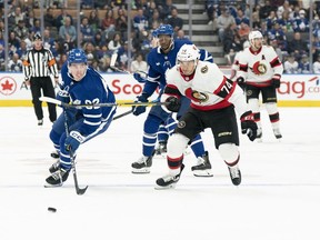 Sep 24, 2022; Toronto, Ontario, CAN; Toronto Maple Leafs defenseman Filip Kral (82) battles for the puck with Ottawa Senators left wing Michael Dal Colle (74) during the second period at Scotiabank Arena.