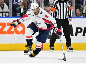Washington Capitals forward Alex Ovechkin chases the puck against the Toronto Maple Leafs in the third period at Scotiabank Arena on October 13, 2022.
