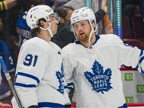 Feb 12, 2022; Vancouver, British Columbia, CAN; Toronto Maple Leafs forward John Tavares (91) and forward William Nylander (88) react after losing to the Vancouver Canucks  at Rogers Arena.
