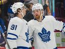 Feb 12, 2022;  Vancouver, British Columbia, CAN;  Toronto Maple Leafs forward John Tavares (91) and forward William Nylander (88) react after losing to the Vancouver Canucks at Rogers Arena.  