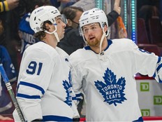 Feb 12, 2022; Vancouver, British Columbia, CAN; Toronto Maple Leafs forward John Tavares (91) and forward William Nylander (88) react after losing to the Vancouver Canucks at Rogers Arena.