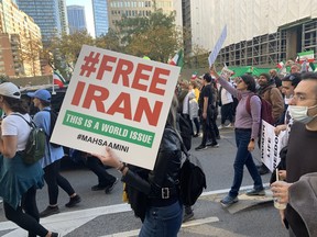 Thousands of people took the streets of downtown Toronto to protest the Iranian regime on Saturday, Oct. 22, 2022.