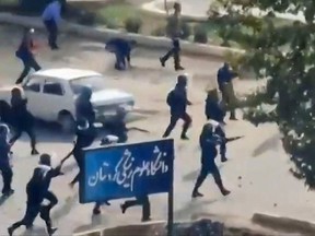 This image grab from a UGC video posted on October 29, 2022, reportedly shows security forces firing at buildings of the Kurdistan University Faculty of Medical Sciences in Sanandaj.