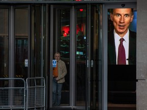Chancellor of the Exchequer, Jeremy Hunt, is seen on a television screen at BBC Broadcasting House as he takes part in a live interview on Oct. 15, 2022 in London.