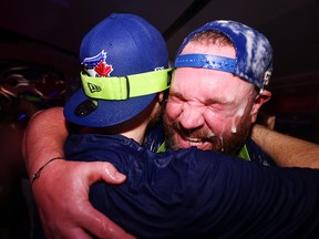 Manager John Schneider of the Toronto Blue Jays celebrates clinching a playoff spot after the win against the Boston Red Sox at Rogers Centre on Sept. 30, 2022 in Toronto, Ontario, Canada.