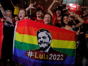Supporters of Brazilian former president and candidate for the leftist Workers Party Luiz Inacio Lula da Silva celebrate while watching the vote count of the presidential run-off election at the Paulista avenue in Sao Paulo, Brazil, on Oct. 30, 2022.