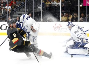 Toronto Maple Leafs goaltender Ilya Samsonov (35) blocks a shot on goal by Vegas Golden Knights center Jack Eichel (9) as Maple Leafs' Morgan Rielly (44) defends during the second period in Las Vegas on Monday night.