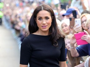 Meghan, Duchess of Sussex meets members of the public walk at Windsor Castle - 2022 - Getty