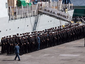 Royal Canadian Navy crew line up during a ceremony for the HMCS Regina at CFB Esquimalt in Esquimalt, B.C., Friday April 29, 2016. New figures from the Department of National Defence show thousands of Canadian Armed Forces members and their families across the country are waiting for military housing.THE CANADIAN PRESS/Chad Hipolito