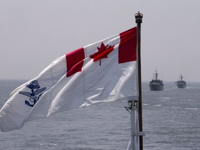 The Royal Canadian Navy Ensign flies