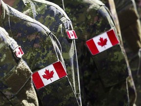 Members of the Canadian Armed Forces march during a parade in Calgary on July 8, 2016.THE CANADIAN PRESS/Jeff McIntosh