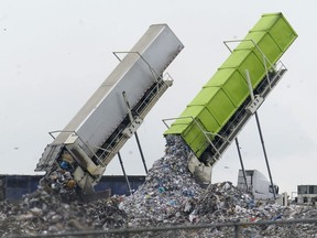 Garbage is off-loaded into the Pine Tree Acres Landfill in Lenox Township, Mich., Thursday, July 28, 2022.