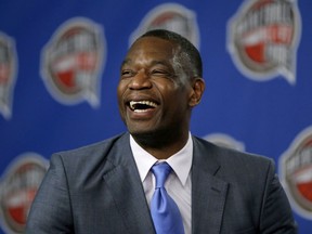 Former NBA basketball player Dikembe Mutombo laughs during a news conference announcing him as one of the 12 finalists of this year's hall of fame class during an event ahead of the NBA All Star basketball game, on Feb. 14, 2015, in New York.