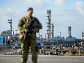 A Norwegian Home Guard soldier stands guard, assisting the police with increased security, at the Karst gas processing plant in the Rogaland county, Norway, on October 3, 2022.